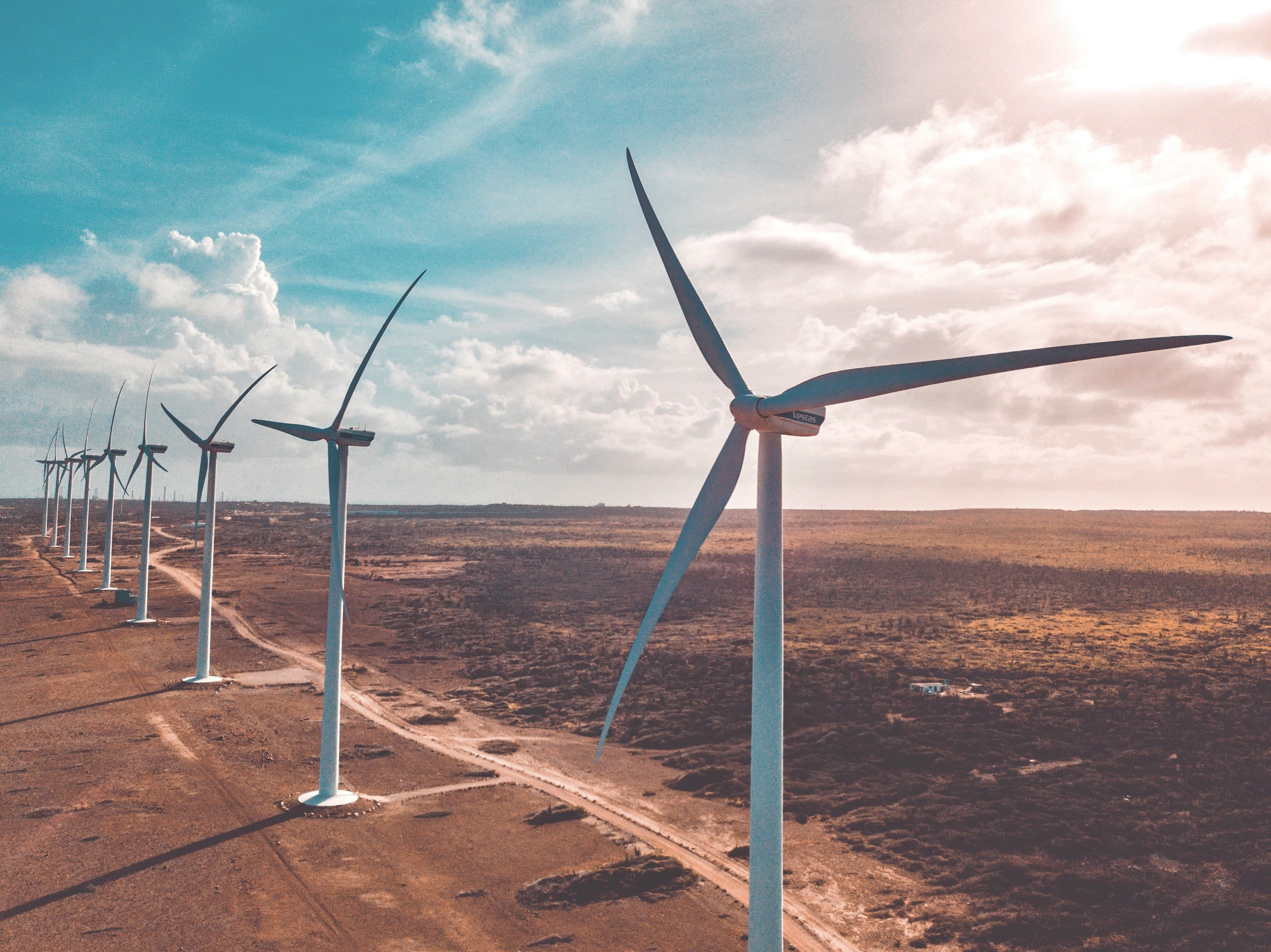 Wind turbines in a line across open land